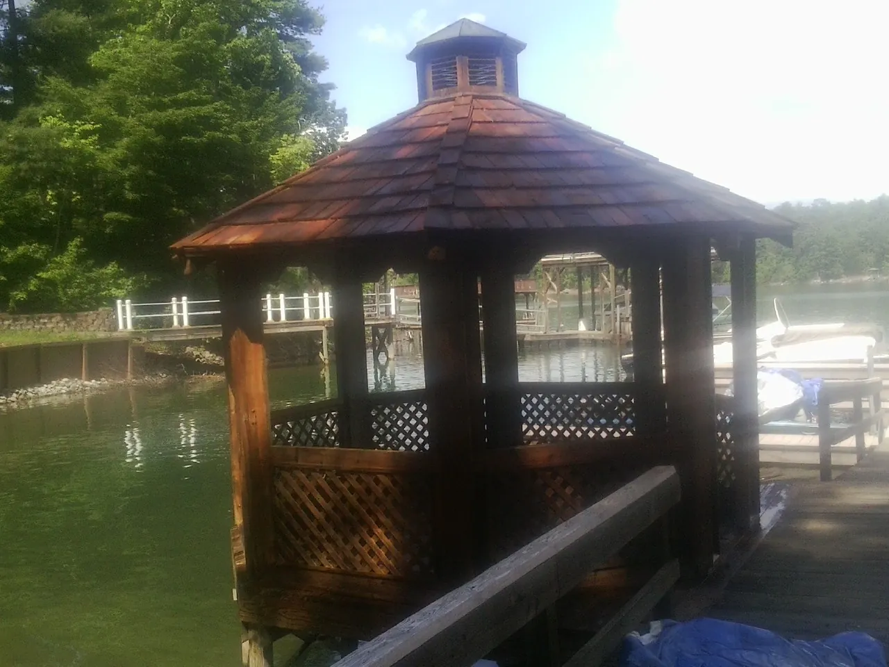 Cedar shake gazebo roof rebuilt on a lake dock in Mastic Beach